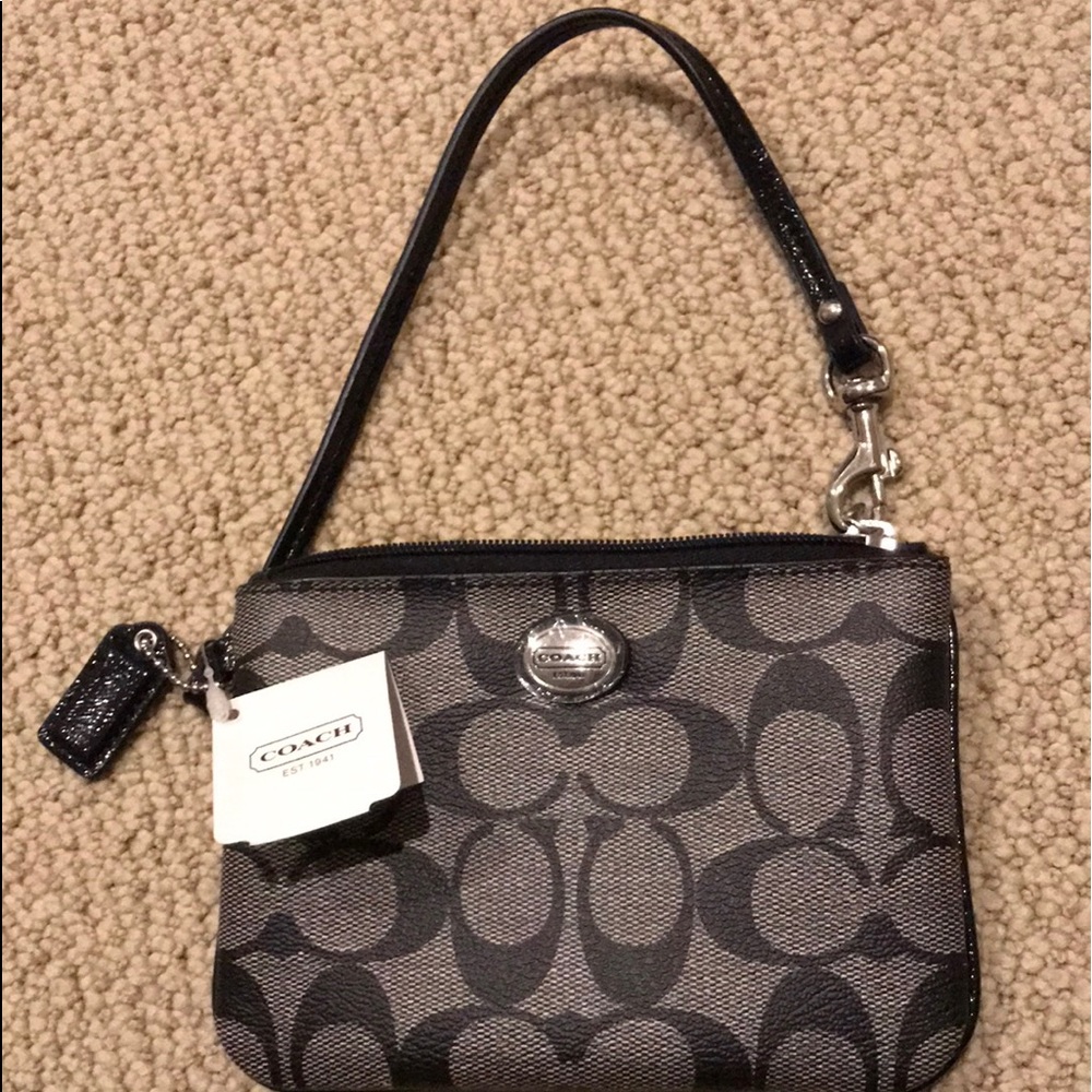 Coach Peyton Wristlet signature leather with tags.
